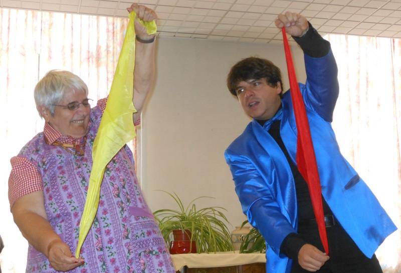 Magician Olivier OK MAGICS interacting with spectator during a show in Bourgogne France fall 2012