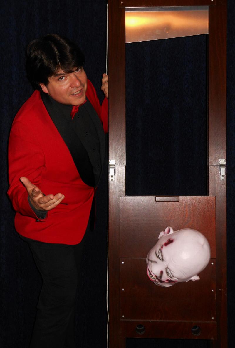 Magician Olivier OK MAGICS with big guillotine illusion