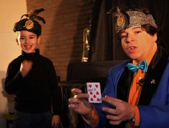 Magician Olivier OK MAGICS interacting with a child during stage show in Brussels 2009