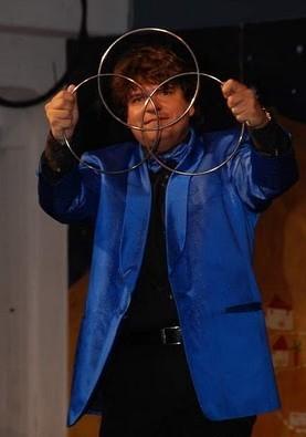 Magician Olivier OK MAGICS performing Linking Rings in Tindaya Fuerteventura in Summer 2010