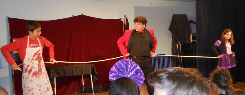 Magician Olivier OK MAGICS interacting with two children in Spain Halloween Tour 2014 